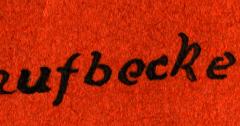 Beschriftete rote Stoffoberfläche mit Aufschrift 'Faufbocken'