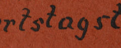 Beschriftete Stoffmarke mit Handschrift 'Bedarfstagslaufe'