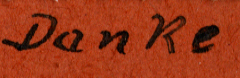 Handschriftliche Aufschrift 'Danke' auf rotem Untergrund