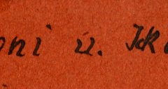 Handschriftliche Beschriftung auf rotem Untergrund