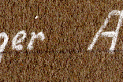 Handschriftliche Beschriftung 'Heiliger Abend' auf Textiluntergrund